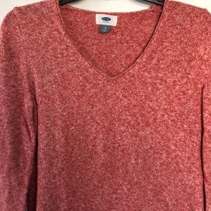 Light salmon sweater.